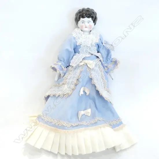 VICTORIAN PORCELAIN DOLL –BLUE DRESS ON STAND  - H. 375MM
